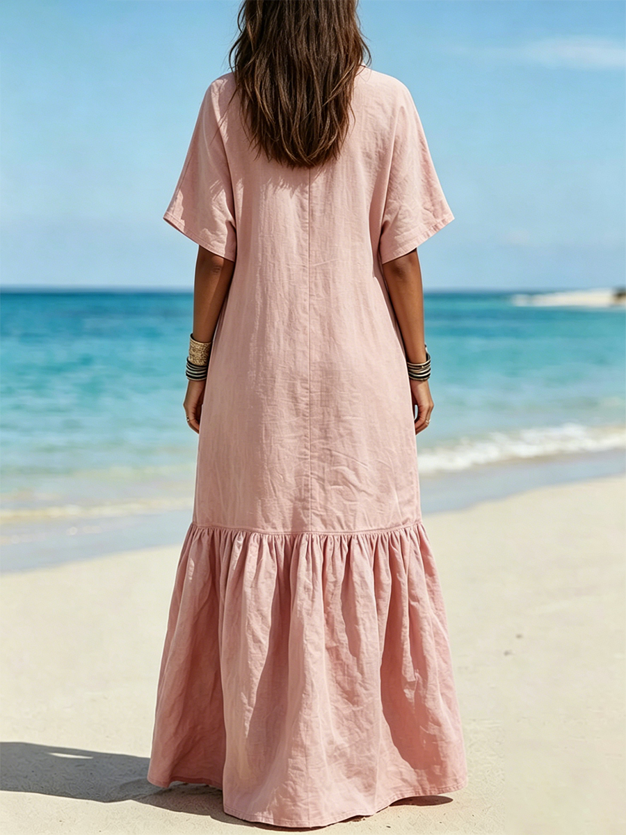 Long Cotton Shirt Dress Featuring A Half-button Placket, Fold-over Collar, Short Sleeves, Patch Pockets, And A Ruffled Hem.