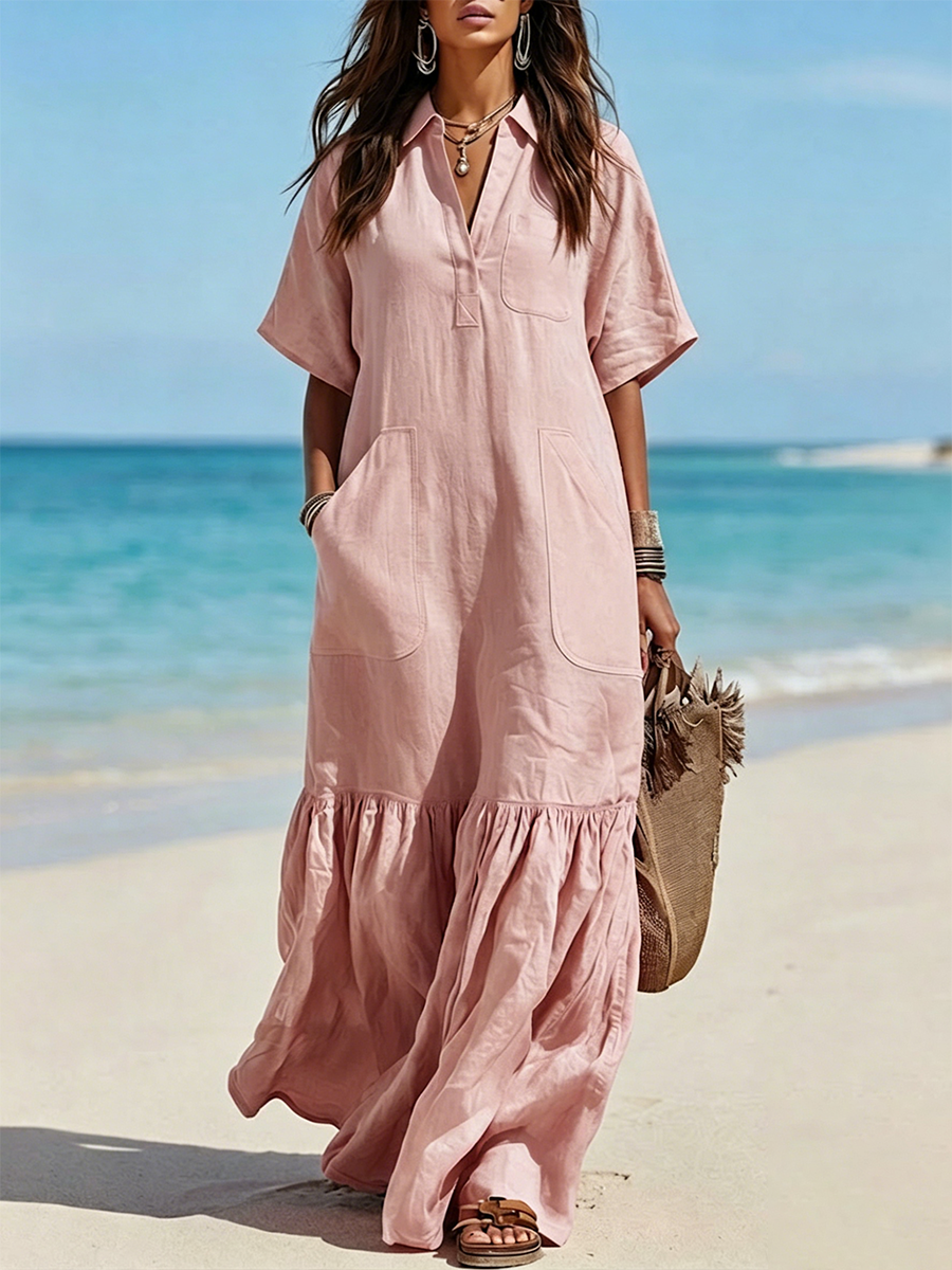 Long Cotton Shirt Dress Featuring A Half-button Placket, Fold-over Collar, Short Sleeves, Patch Pockets, And A Ruffled Hem.