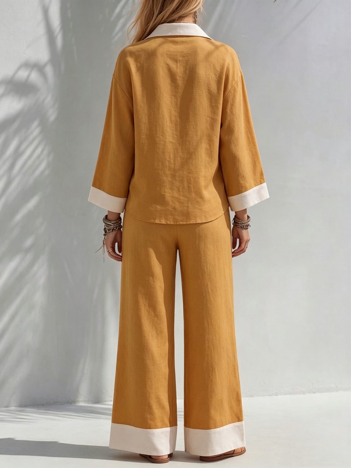 Cotton-linen Two-piece Set Featuring A Collared V-neck Top With Three-quarter Sleeves And Wide-leg Pants With An Elastic Waist.